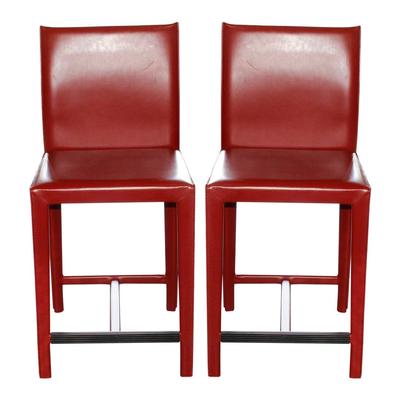 Pair of Red Maria Yee Leather Stools